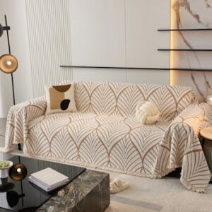 A modern living room featuring a beautifully covered sofa with elegant patterns. Ideal for home decor inspiration.