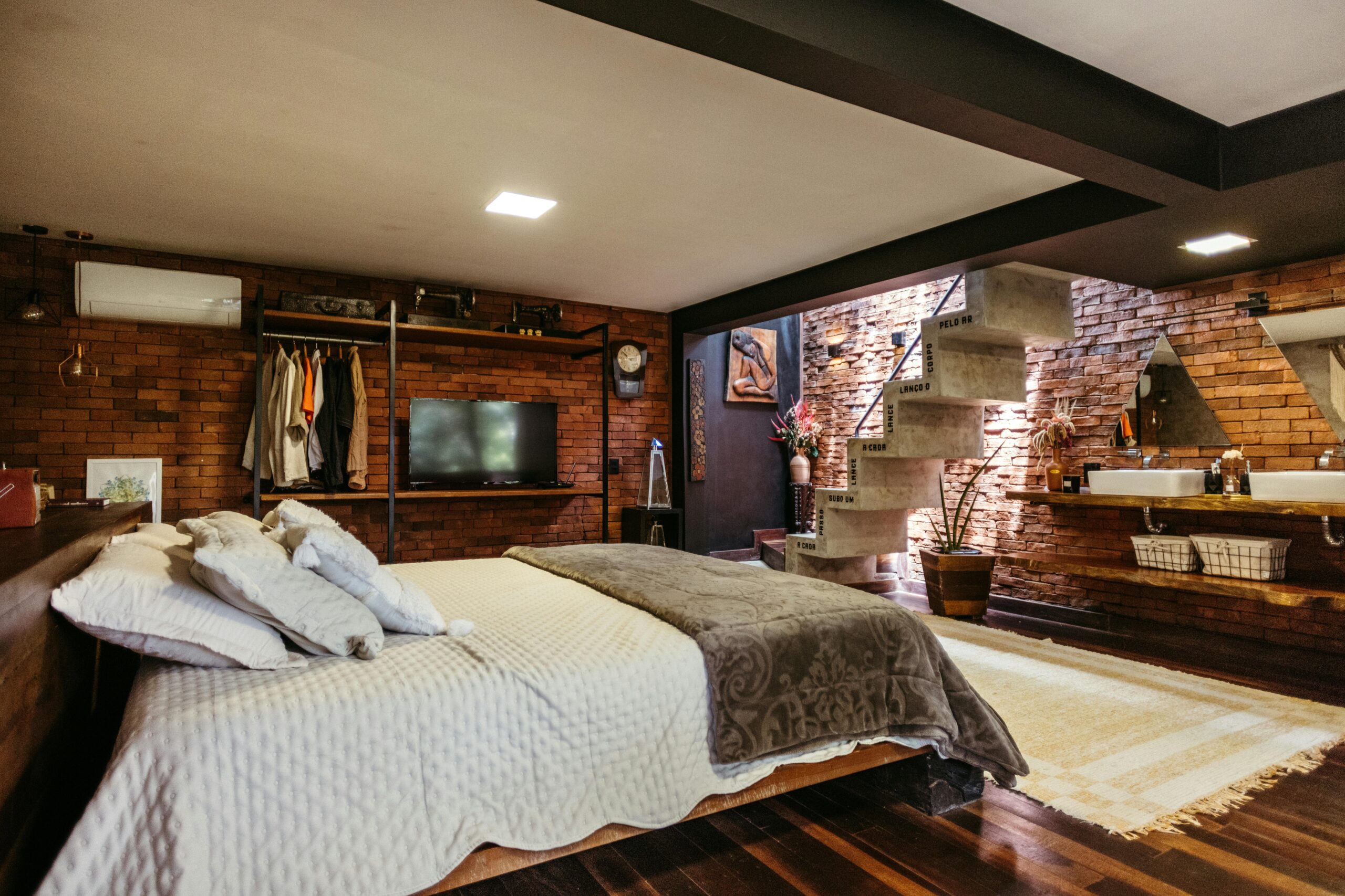 Stylish bedroom interior with unique staircase in Santa Teresa, Brazil.